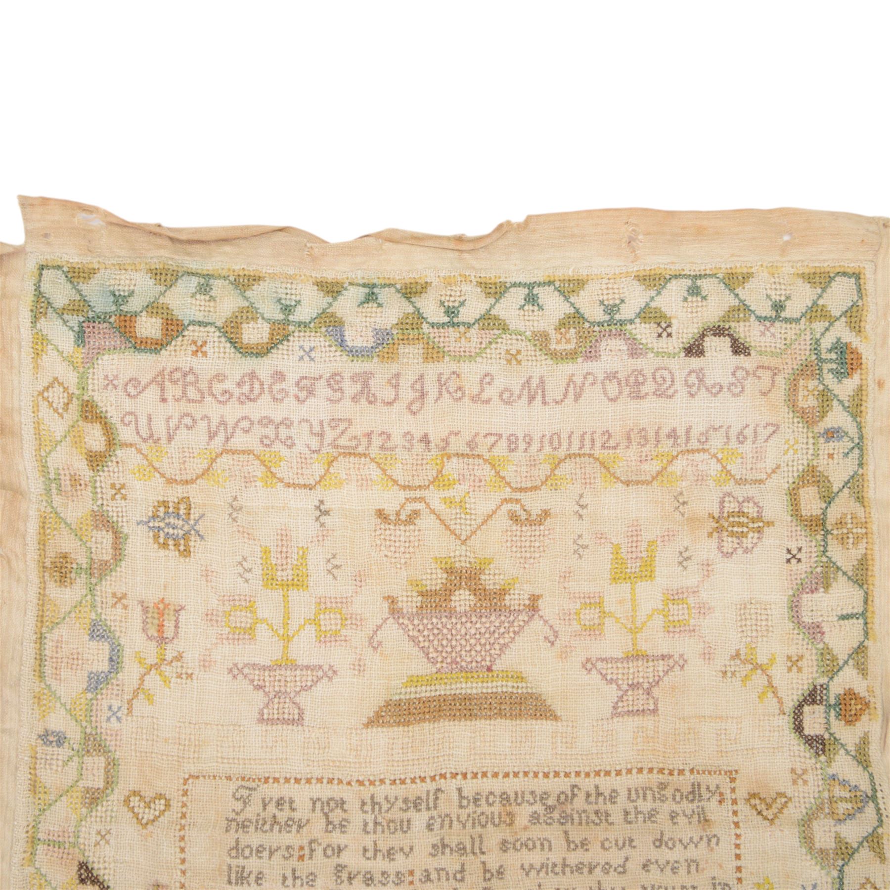 Early 19th century sampler worked by Mary Audley aged 15 years dated 1818, depicting alphabet and numbers above a religious passage, bordered by animals, buildings and insects, unframed, H45cm
