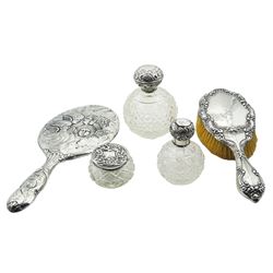 Edwardian silver mounted handheld mirror, decorated in relief with a