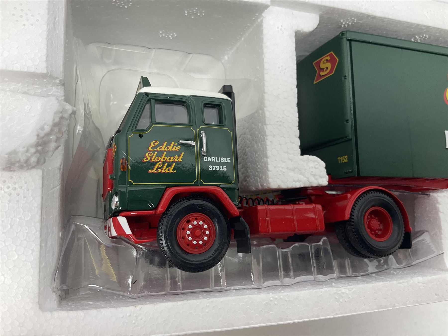 Corgi Eddie Stobart - three limited edition lorries; CC12901 Scania Topline Curtainside; CC13101 Volvo F88 Box Trailer; and CC13207 DAF XF Space Cab & Flatbed Trailer; all boxed (3)