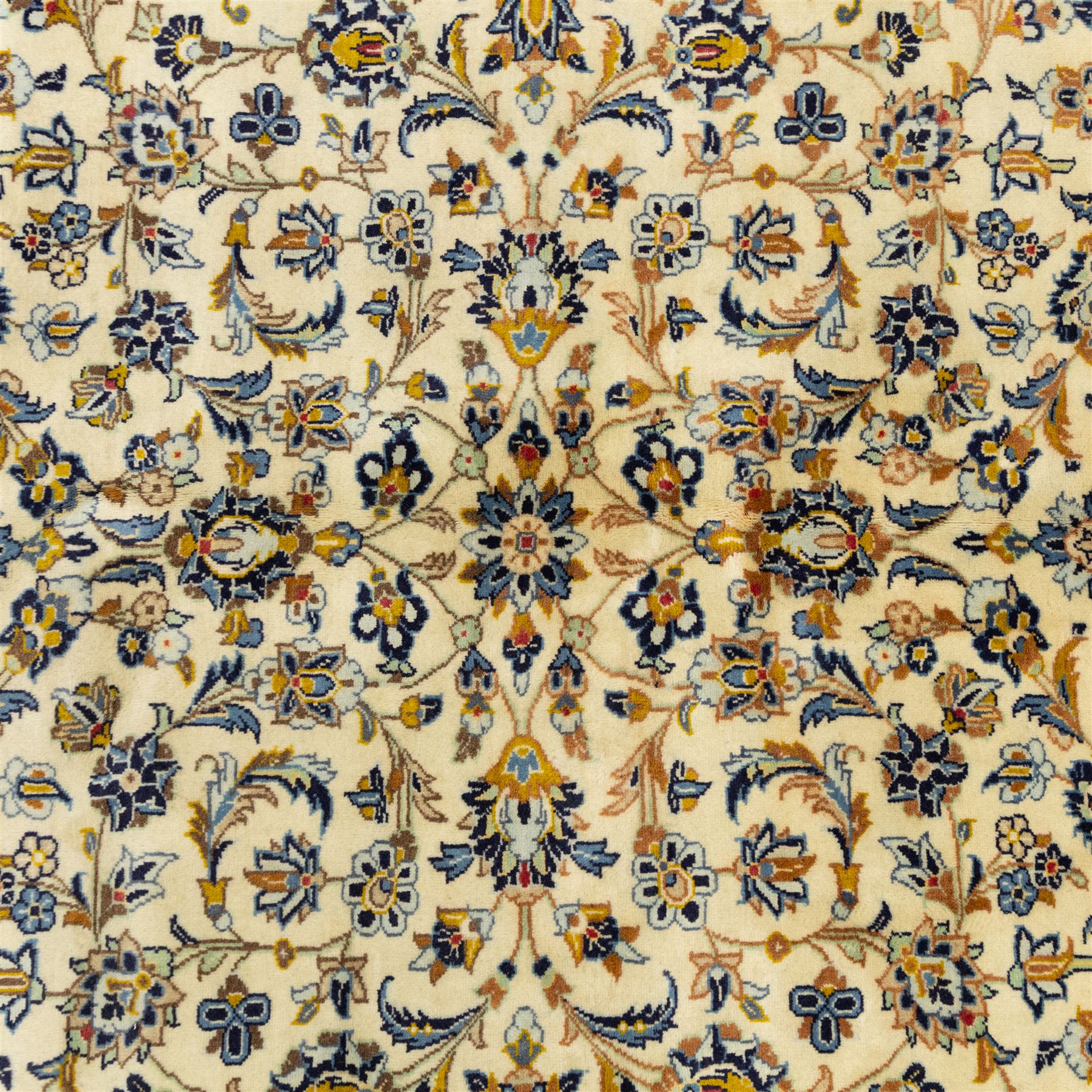 Central Persian Ardakan hand-knotted carpet, ivory field finely decorated with a symmetrical lattice of scrolling vines palmettes and flowering sprays arranged around a delicate central medallion enclosed by a pale border of stylized floral and vine ornament between multiple guard stripes with cotton fringe ends 
