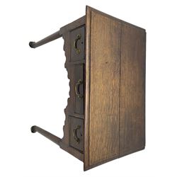 18th century oak low-boy, ovolo-moulded rectangular top over three cock-beaded drawers, circular brass handle plates and D-shaped handles, shaped and stepped arched apron, on cabriole supports 