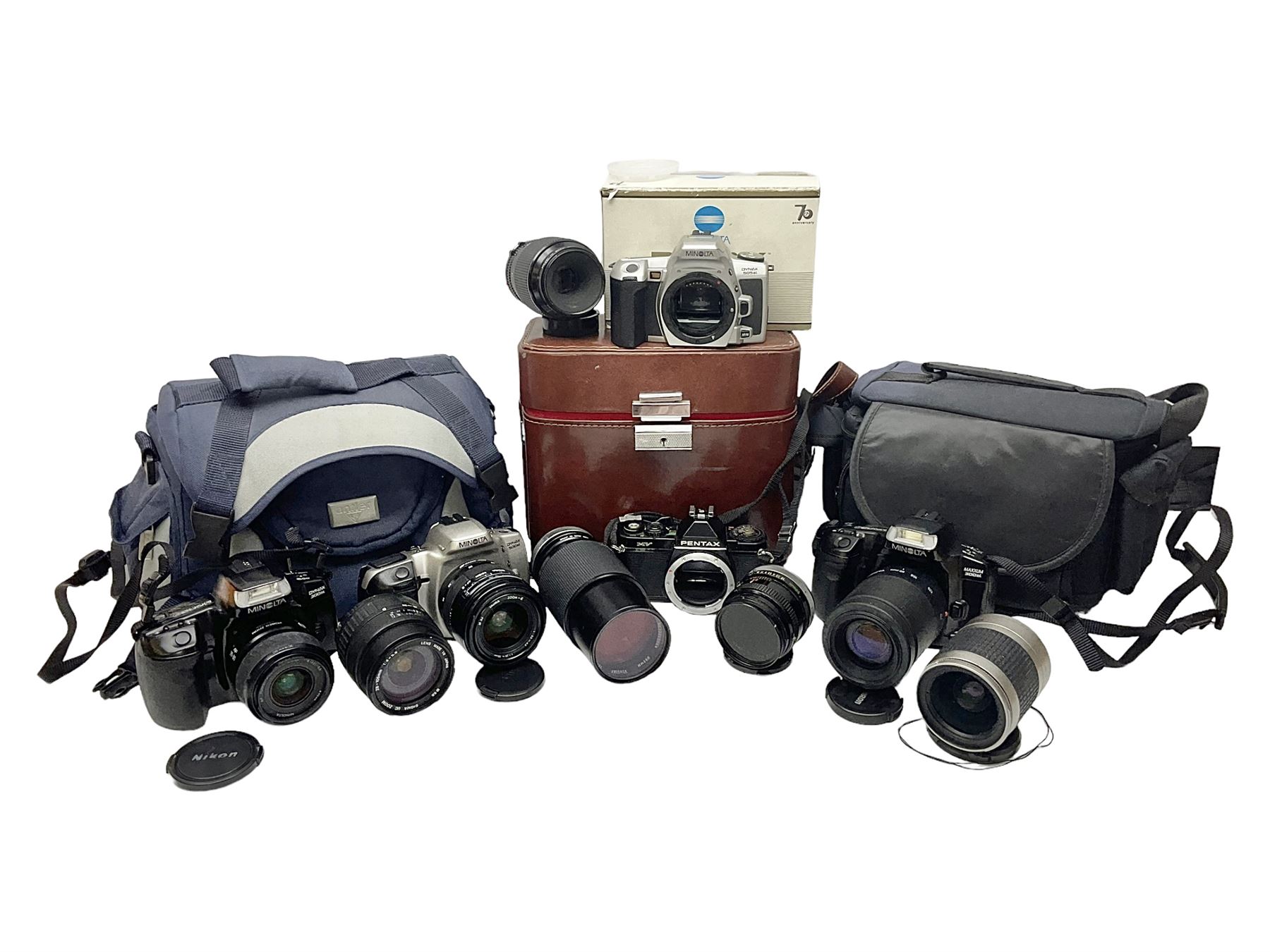 Four Minolta camera bodies, to include Dynax 500si, serial no. 94812651 with 'Signa Zoom 1;3.5-4.5 f=28-70mm' lens, Maxxum 300si, serial no. 97821665, with 'Tamron AF 80-210mm' lens and Dynax 300si, serial no 01603265'  with Minolta AF Power Zoom 35-80mm 1;4' lens, etc, together with Pantax MV1 camera bodies and other camera equipment 