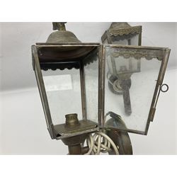 Pair of metal coach lanterns, converted into wall lights, each with eagle finial and four clear glass panels, H39cm 
