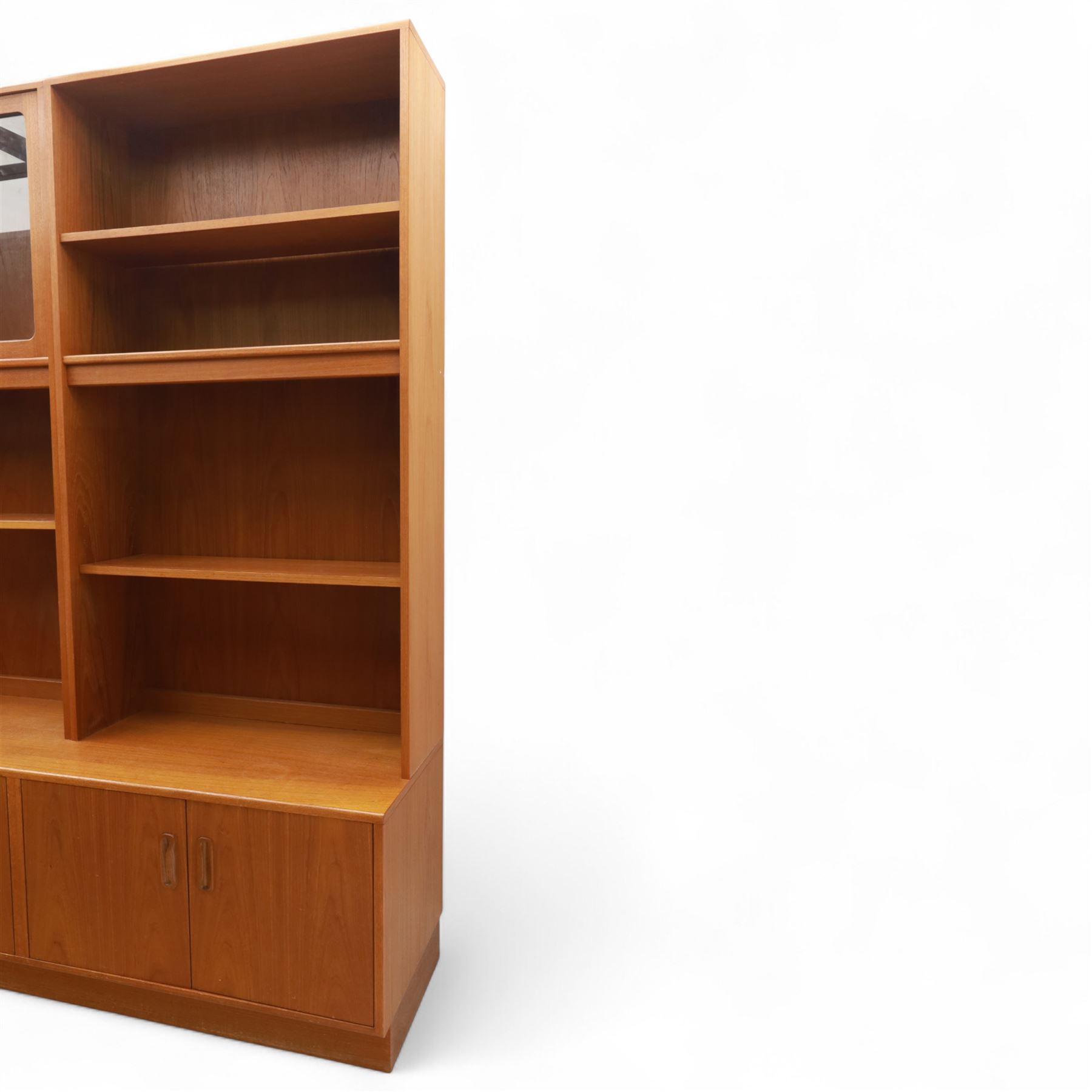 G Plan - Mid 20th century teak sectional wall cabinet, comprising six modular units including a fall front bureau, glazed display cabinet, open bookcase, cupboard and drawer bases, each with recessed handles and flush plinths