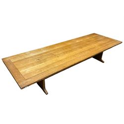 Large early 20th century ecclesiastical oak refectory dining table, rectangular top over end supports with sledge feet, united by single stretcher