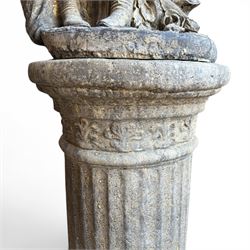 Composite garden statue group of Romeo and Juliet embracing, the couple adorned in Medieval dress standing on a naturalistic base with fallen flowers, raised on a Neoclassical fluted pedestal with Anthemion leaf motifs