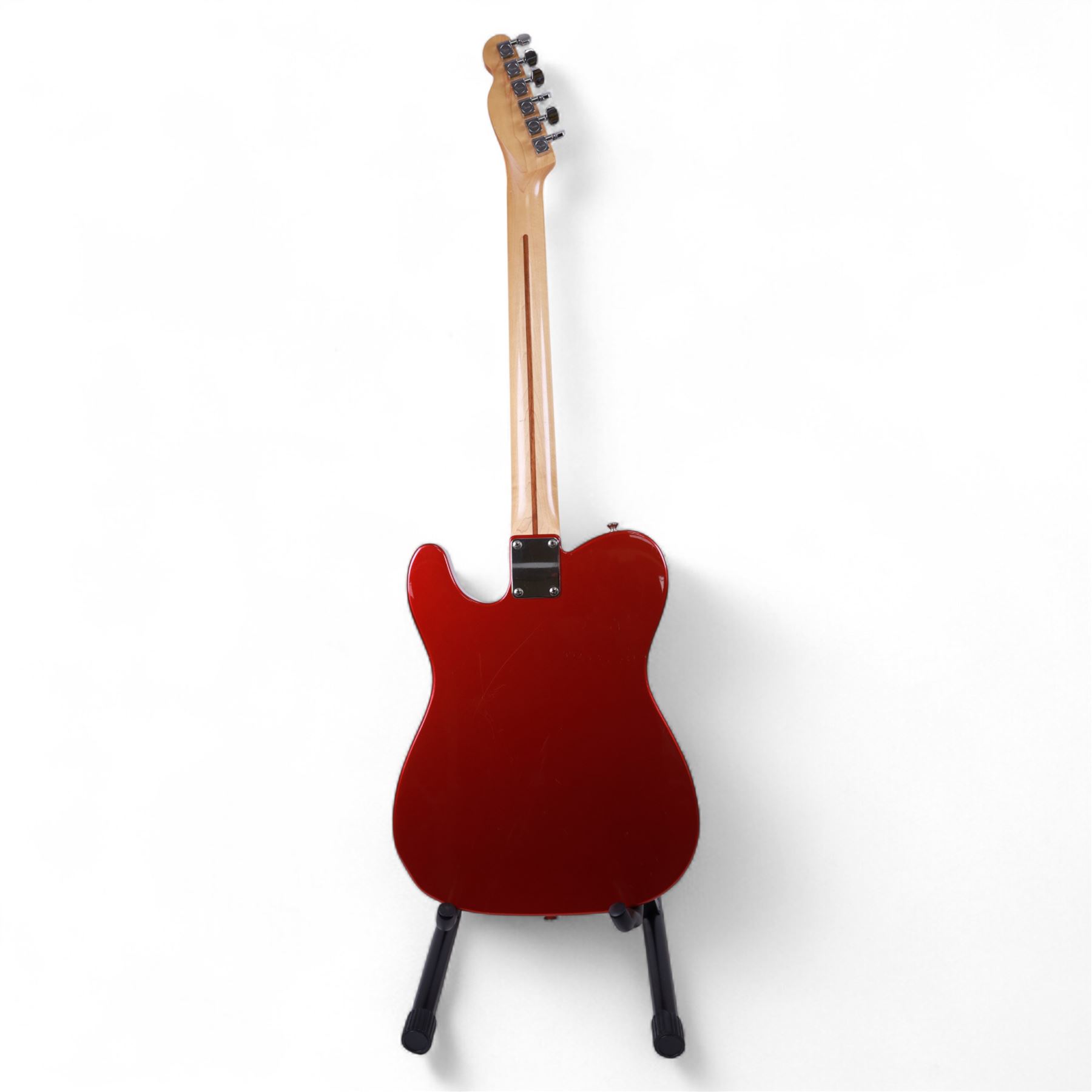 Fender Telecaster electric guitar, serial no. T021384 made in Japan c.1994, with Candy Apple Red body, white scratch plate and maple neck, guitar L98cm