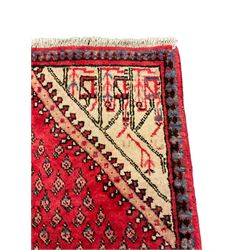 Small Persian red ground rug, lozenge medallion surrounded by small Boteh motifs