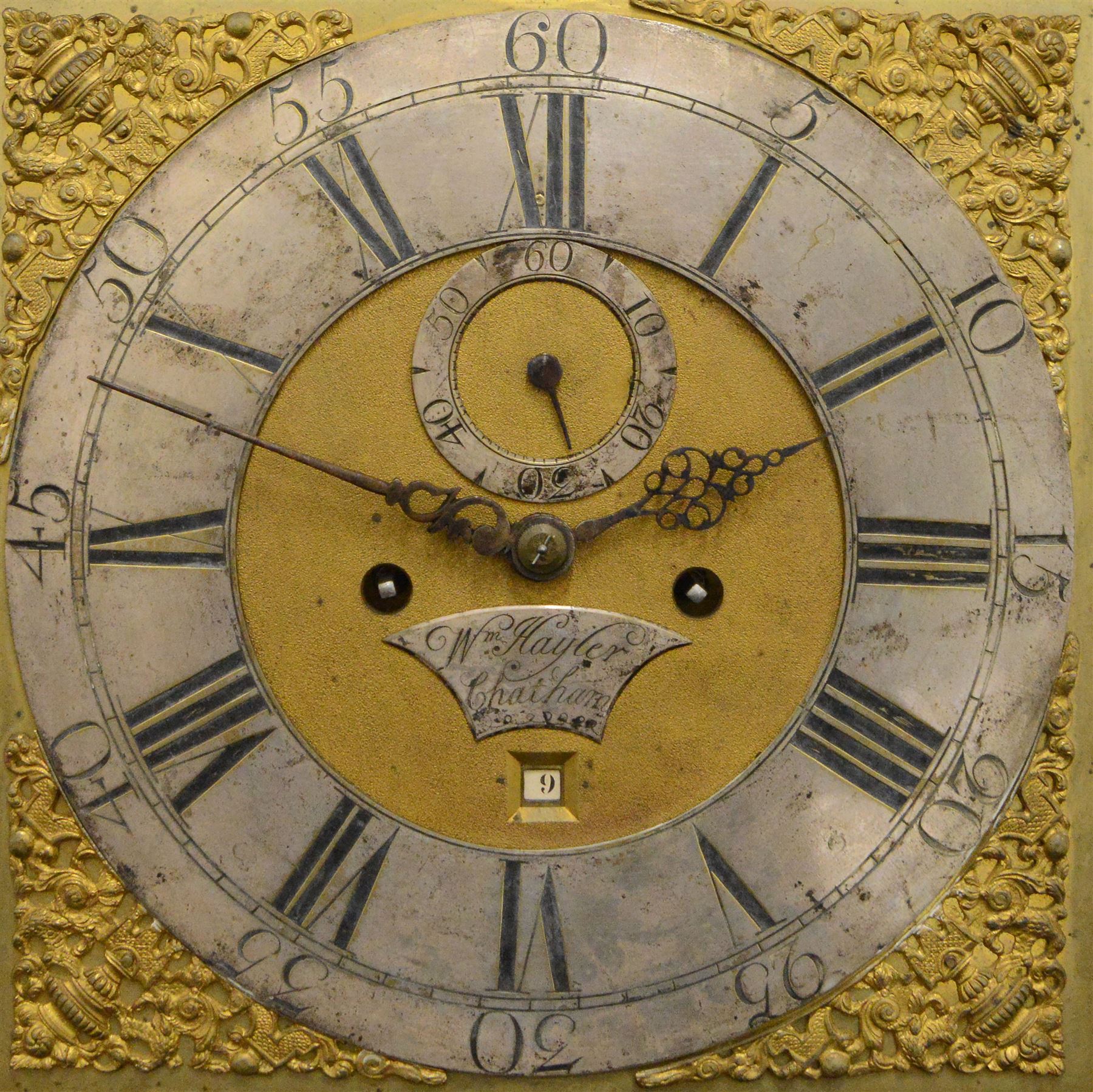 William Hayler of Chatham (Kent) - Fine George III black japanned chinoiserie decorated longcase clock c1760,  hood with a break arch top, glazed side panels and three matching wooden finials, conforming hood door beneath with attached pilasters, long trunk with a  break arch door and moulded surround, on a square double stepped plinth with a flat base, case and hood profusely decorated with scenes of gilt pagodas, temples, birds, people and panels of floral decoration, brass dial with cast brass spandrels and a silvered boss to the arch, silvered chapter with Roman numerals, minute track and five minute Arabic's, matted dial centre with seconds dial, date aperture, matching steel hands and silvered cartouche with makers name, dial pinned directly to a five-pillar rack striking movement with a recoil anchor escapement. With  pendulum, weights  and key.
William Hayler is recorded as working in High Street, Chatham, from 1750-1810, possibly two makers (father & son) working in succession.

