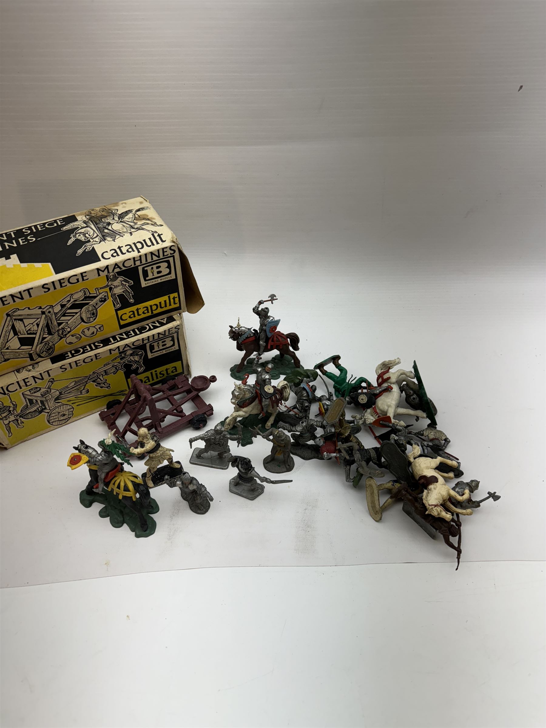 Two Britain's Ancient Siege Machines, comprising Balista and Catapult and a collection of plastic knights and soldiers, including Britains examples etc