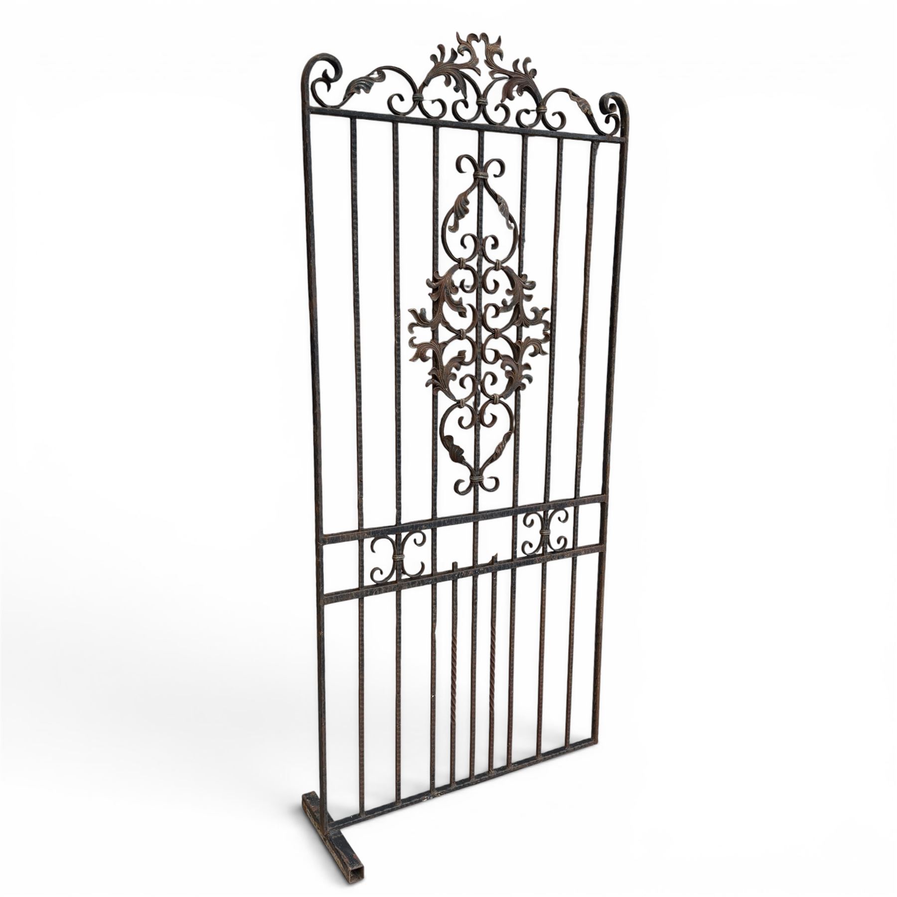 Victorian wrought iron vineyard gate, with ornate scrollwork and foliate acanthus leaf decoration, shaped cresting and central decorative panel, finished in rustic black painted finish