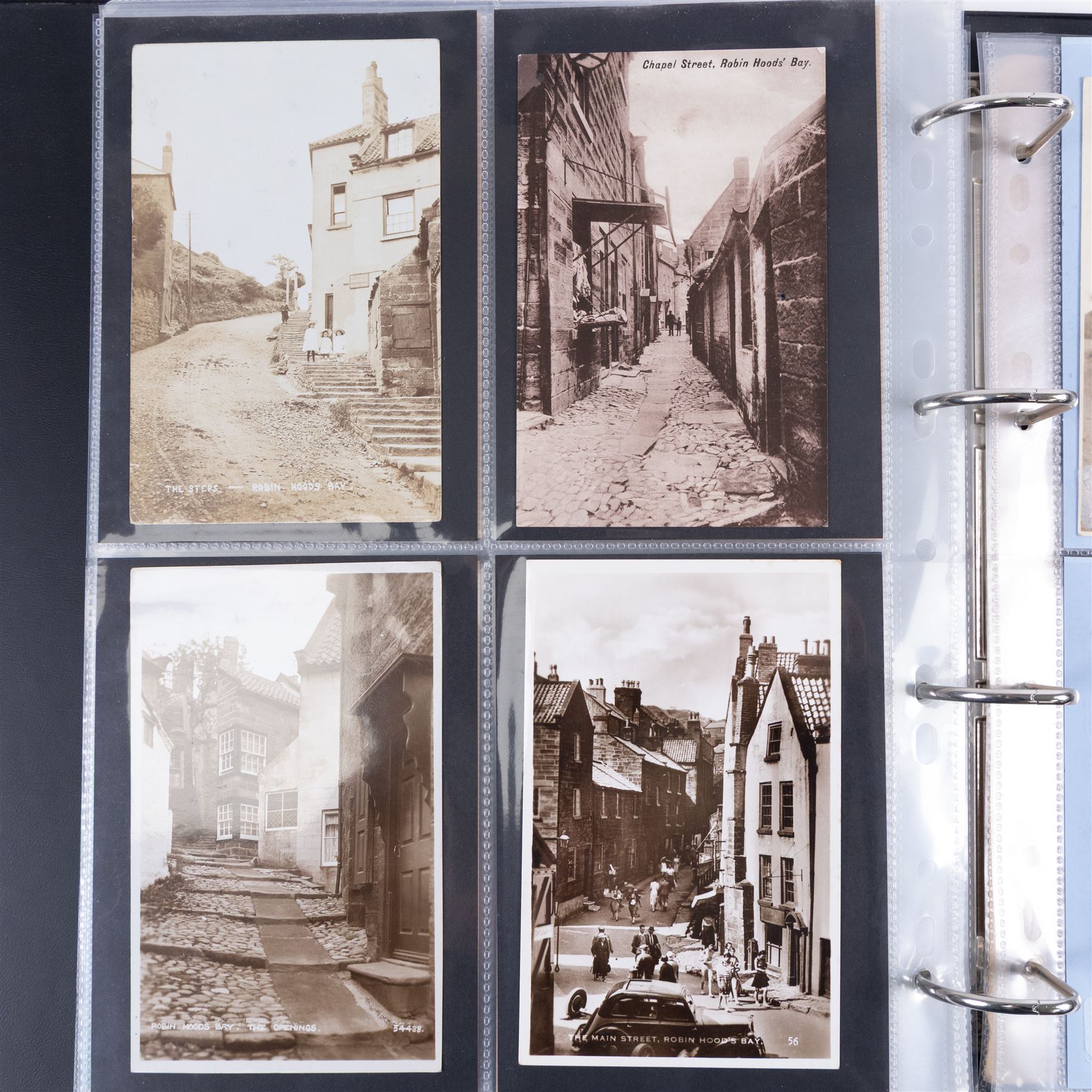 Four-hundred and twelve early 20th century Whitby District view real photographic postcards, including a selection from the Whitby Coast (176), starting at Staithes and Runswick Bay down to Robin Hoods Bay and a selection from the Valley of the River Esk (236), including Ruswarp, Rig Mill, Sneaton, Sleights, Grosmont, Egton, Glaisdale, Danby, Castleton and Goathland, all housed within two postcard albums