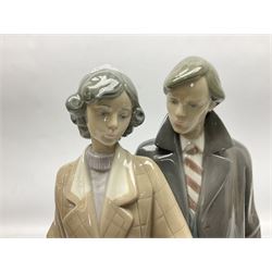 Lladro figure, Sad Parting, modelled as a man and woman with suitcases, sculpted by Francisco Catalá, with original box, no 5583, year issued 1989, year retired 1991, H33cm
