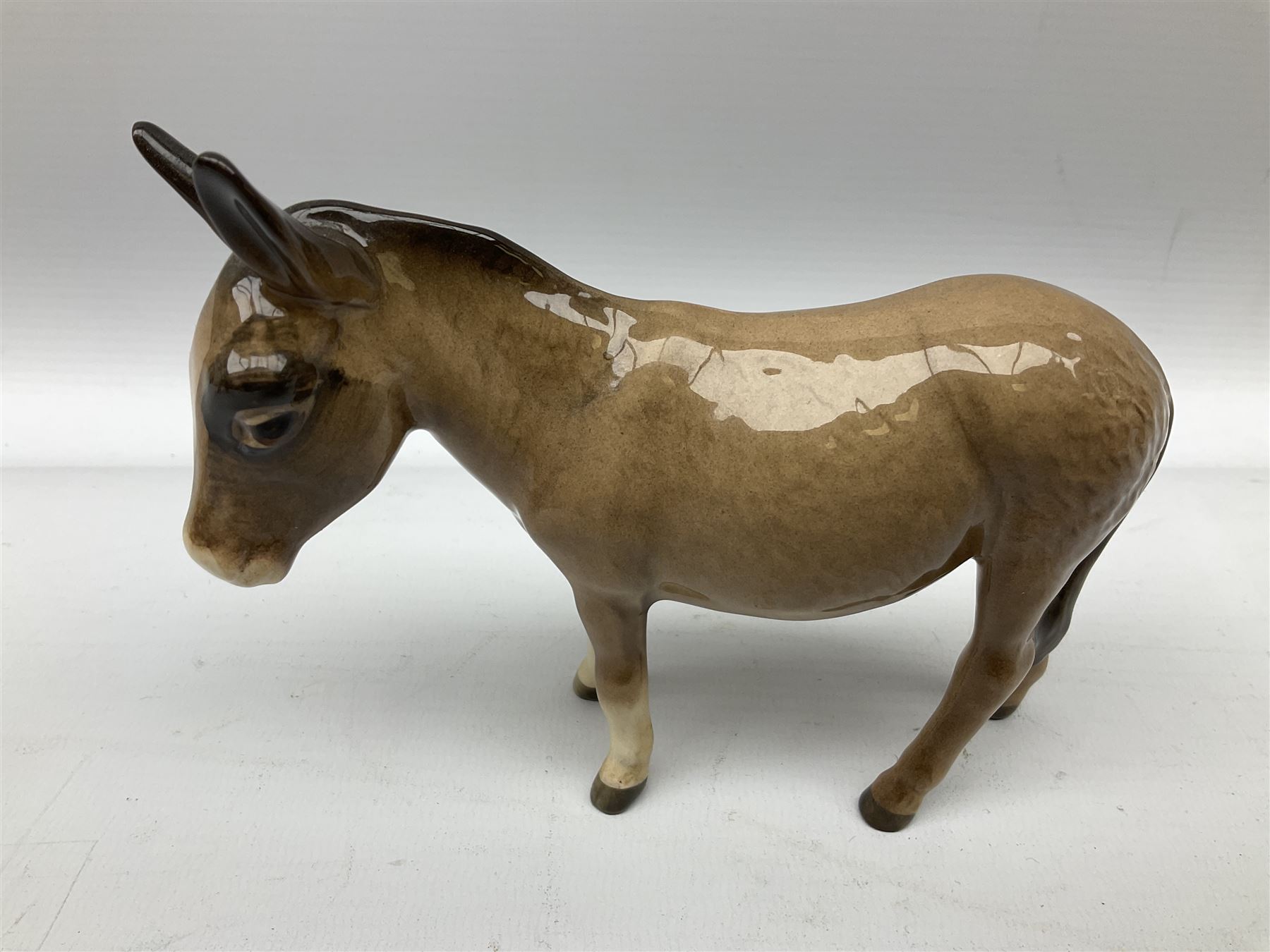 Beswick donkey family to include no.1364b, no.2267a, another donkey and donkey foal (4)