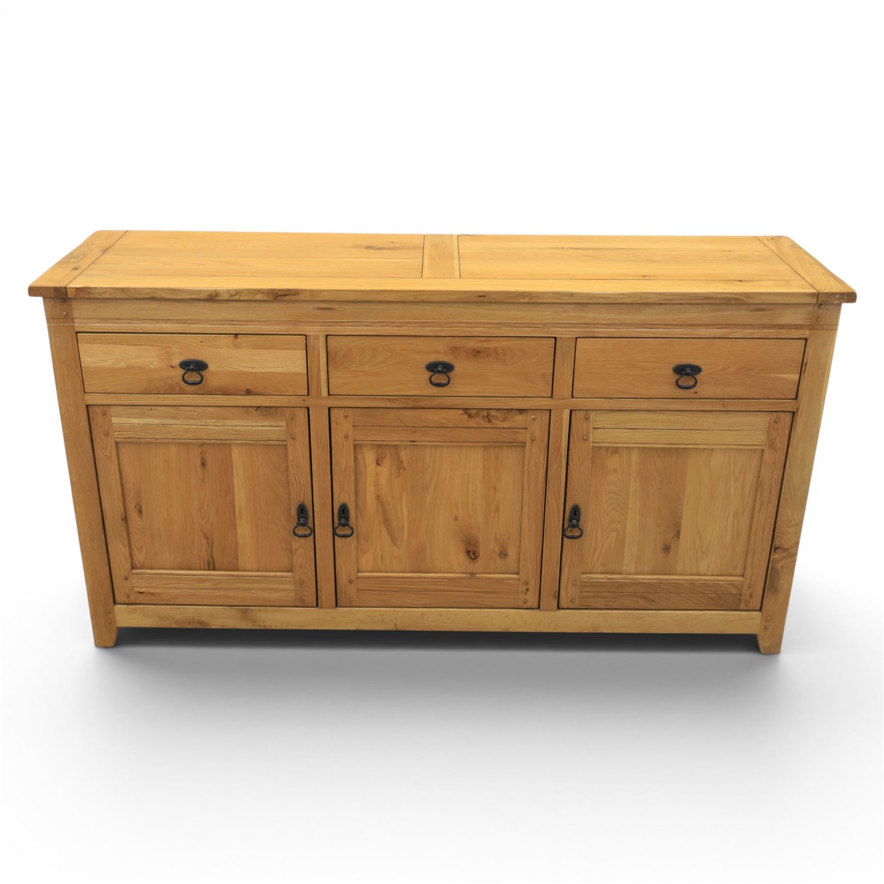 Contemporary oak sideboard, with rectangular top above three drawers and three cupboard doors, blackened metal handles, raised on stile supports
