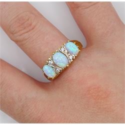 Silver-gilt three stone opal and cubic zirconia ring, stamped Sil 
