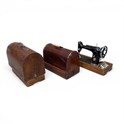 Three Singer wooden cased sewing machines 