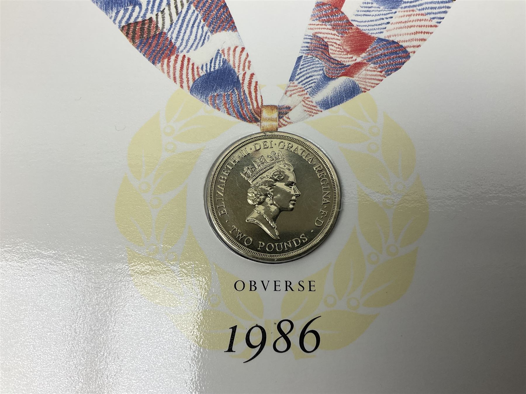 Two Great Britain and Northern Island proof sets dated 1970 and 1971, both with card cases, three 1986 Commonwealth Games commemorative two pound coins, in card folders, and six brilliant uncirculated one pound coins, in card folders