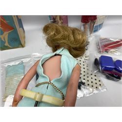 1960s Palitoy Tressy fashion doll, boxed with stand and booklets; four additional Tressy outfits (In The Office, Winter Journey, Winter Sports and Evening Date); two other outfits; and Tressy's Little Sister Toots doll with Style Book and additional outfit