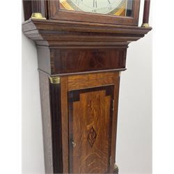 Early 19th century oak and mahogany longcase clock, scrolled swan neck pediment over figured frieze, square enamel Roman and Arabic dial, the spandrels decorated with painted fan motifs and concentric Greek key and stylised flower head bands, signed 'D. Rowland Aberystwith', thirty hour movement striking on bell, rectangular trunk door with rosewood banding with central floral inlay, canted corners with fluted quarter columns, the base with rosewood banding, on bracket feet