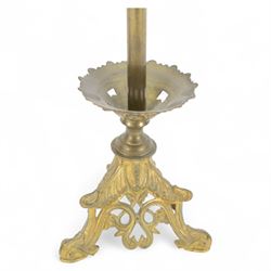 Pair of late 19th century gilt cast candelabra, each with scrolling tripartite base leading to an acanthus detailed circular pan and plain stem, supporting three arms entwined with lily flowers and leaves, the sockets also modelled as lily flowers, H60cm