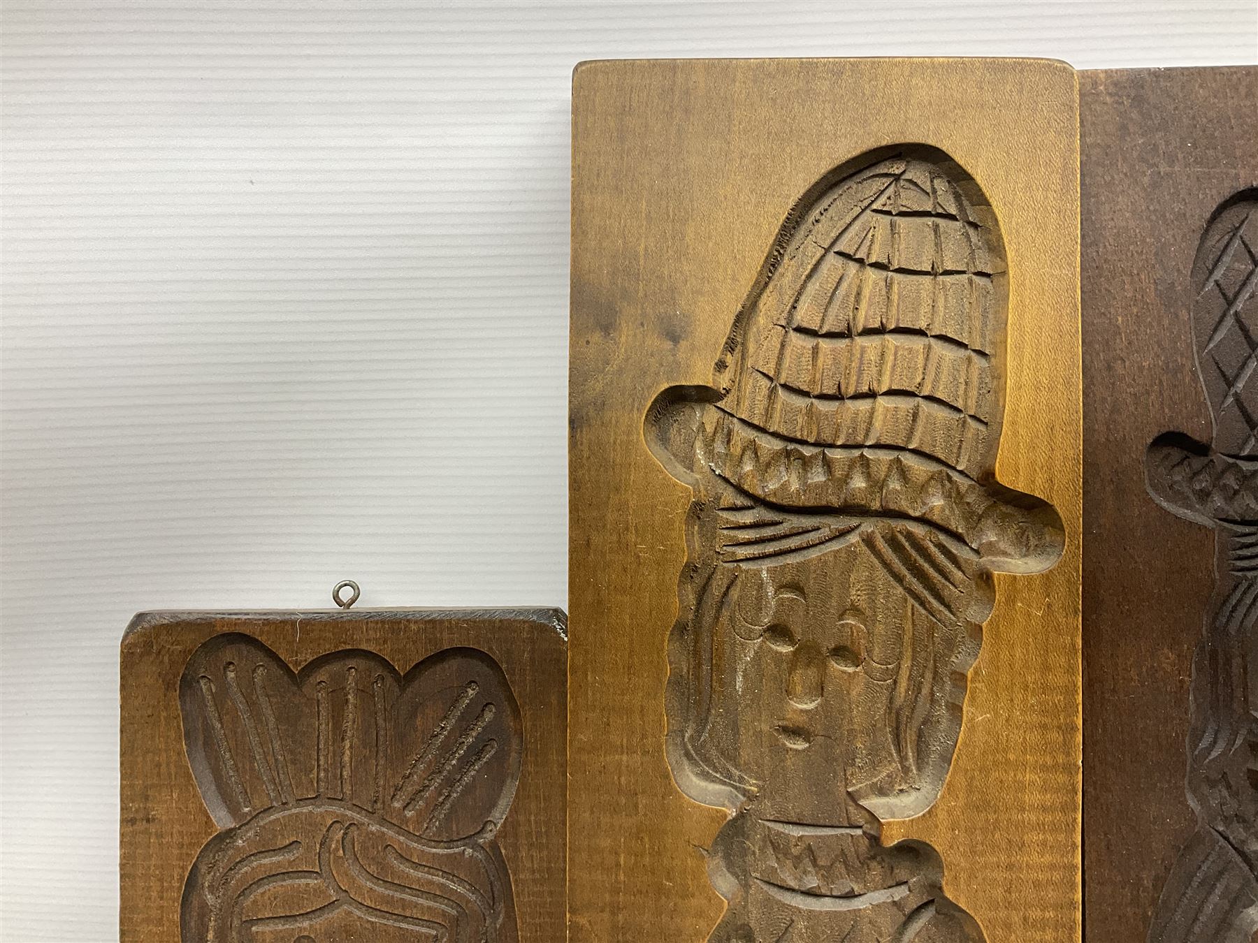Six 20th century hardwood Dutch folk art Speculaasplank or biscuit moulds, typically carved with figures in traditional dress, largest H101cm