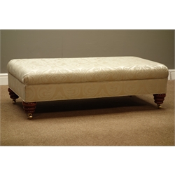  Rectangular upholstered footstool on turned supports with brass castors, 125cm x 60cm, H38cm  