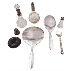 Group of silver mounted items, to include hand mirror and hair brush, each with vertical bands of engine turned decoration, together with two glass scent bottles with silver collars, silver handled bread fork, etc, all hallmarked 