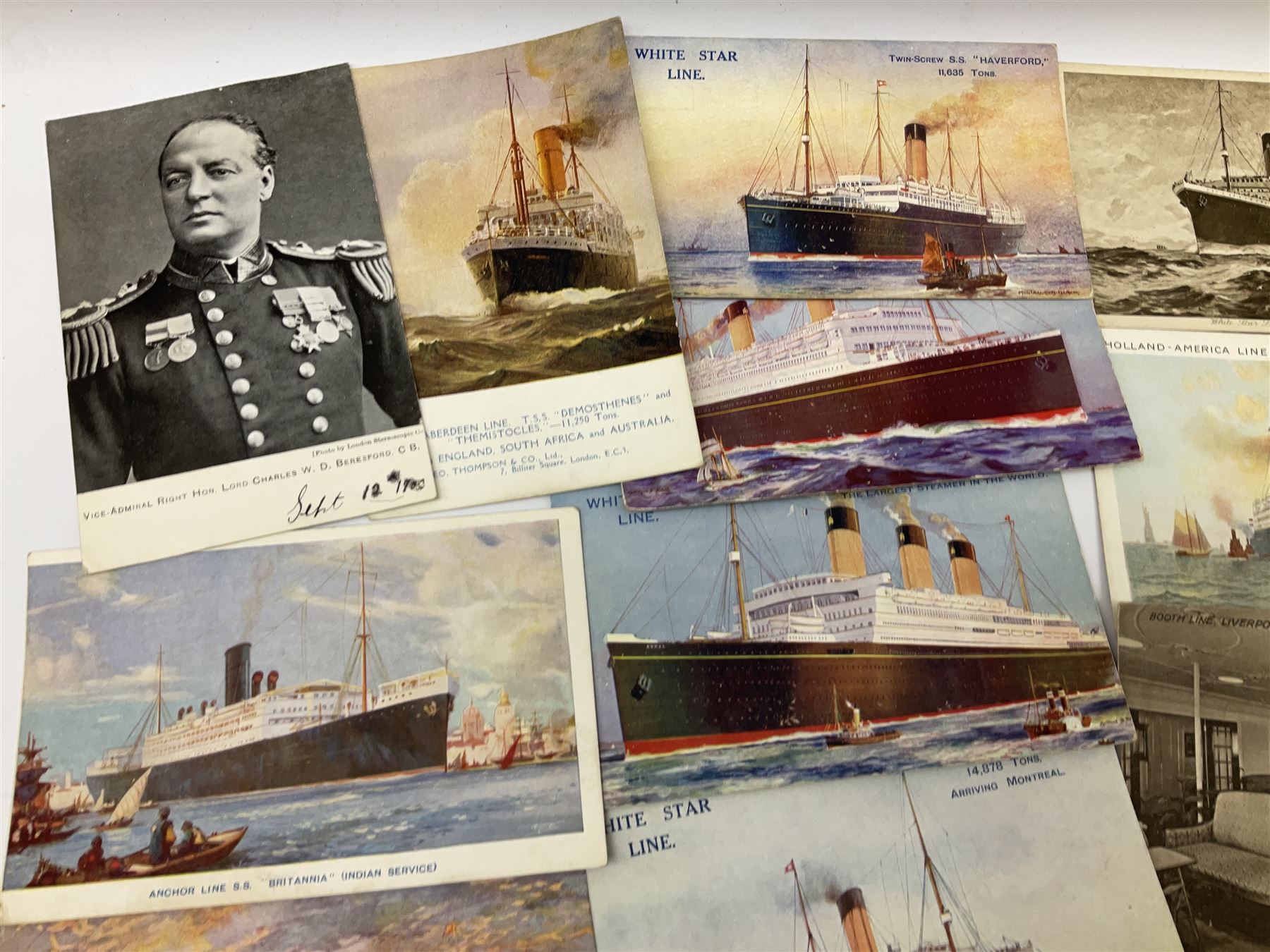 Sixty-five early 20th century postcards of passenger liners including White Star, Red Star, Atlantic Transport, Anchor, Cunard, Henderson, Booth, Union Castle, Holland America, Lamport & Holt, P. & O., New Zealand, Canadian Pacific, British India etc; and ten Edwardian postcards of Naval warships and officers (75)
