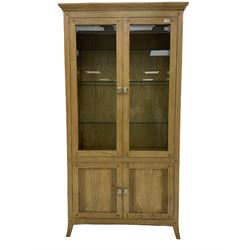 Windsor by Mark Devany oak display cabinet, with two glazed doors and two cupboards, bevelled glass doors, illuminated interior