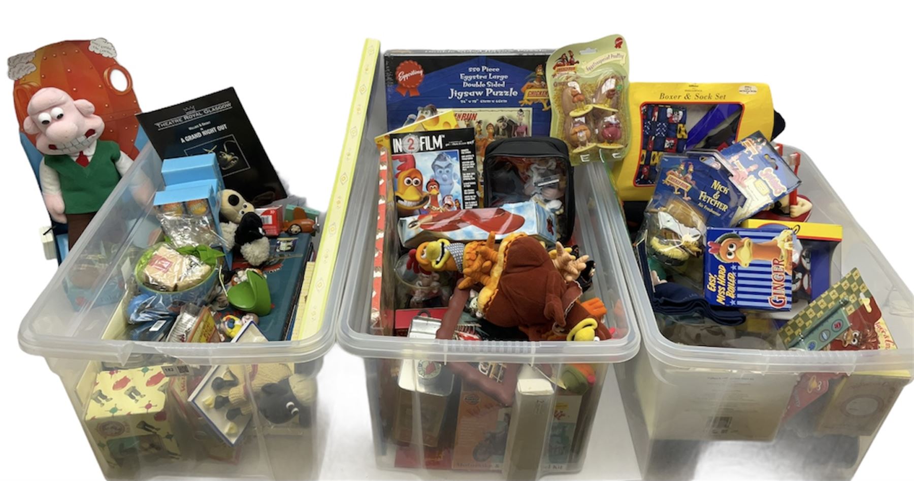 Quantity of Wallace and Gromit toys, accessories and memorabilia including soft toys, figurines, electronic ‘Talking Wallace’, car screen shades, and a quantity of Chicken Run Related merchandise, in three boxes
