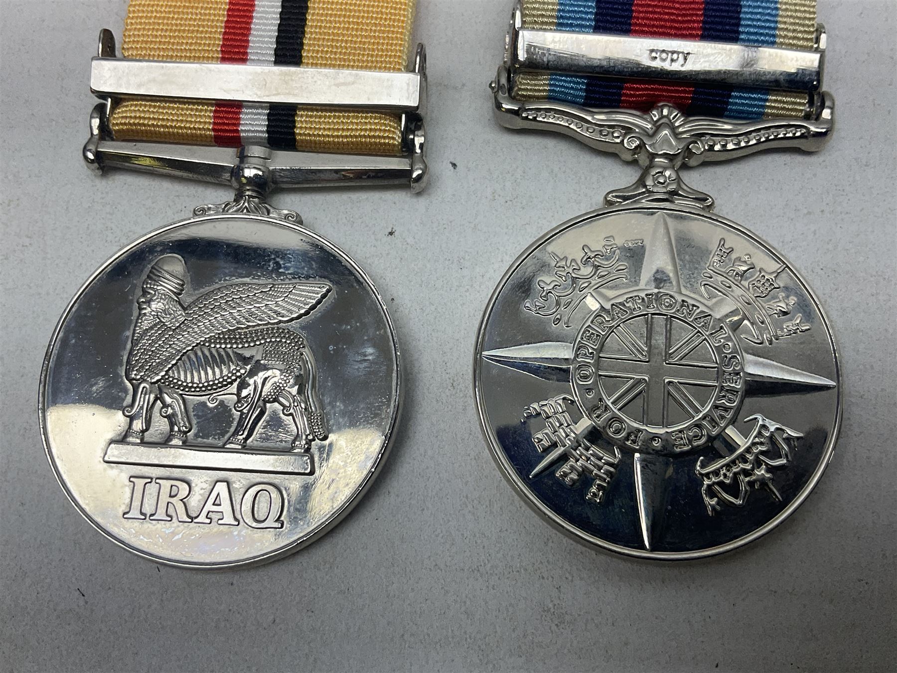 NATO Service Medal with clasp for Former Yugoslavia; together with three copy medals - Iraq Medal with clasp for 19 Mar to 28 Apr 2003 and unfitted rosette; Operational Service Medal with Afghanistan clasp; and QEII Golden Jubilee 2002 medal; all with ribbons (4)