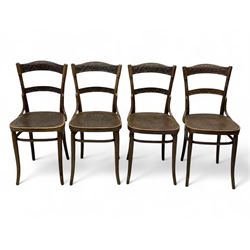 Jacob & Josef Kohn - set of four early 20th century Austrian bentwood chairs, each with carved decoration to the shaped backrest and shaped seat, on splayed supports with stretchers, marked with the manufacturer's stamp and paper label beneath