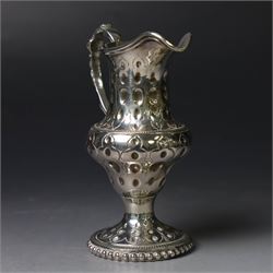George III silver cream jug, of baluster form with hammered dimpling throughout and scroll handle, upon circular spreading foot with beaded edge, hallmarked Thomas Shepherd, London 1784, H10cm