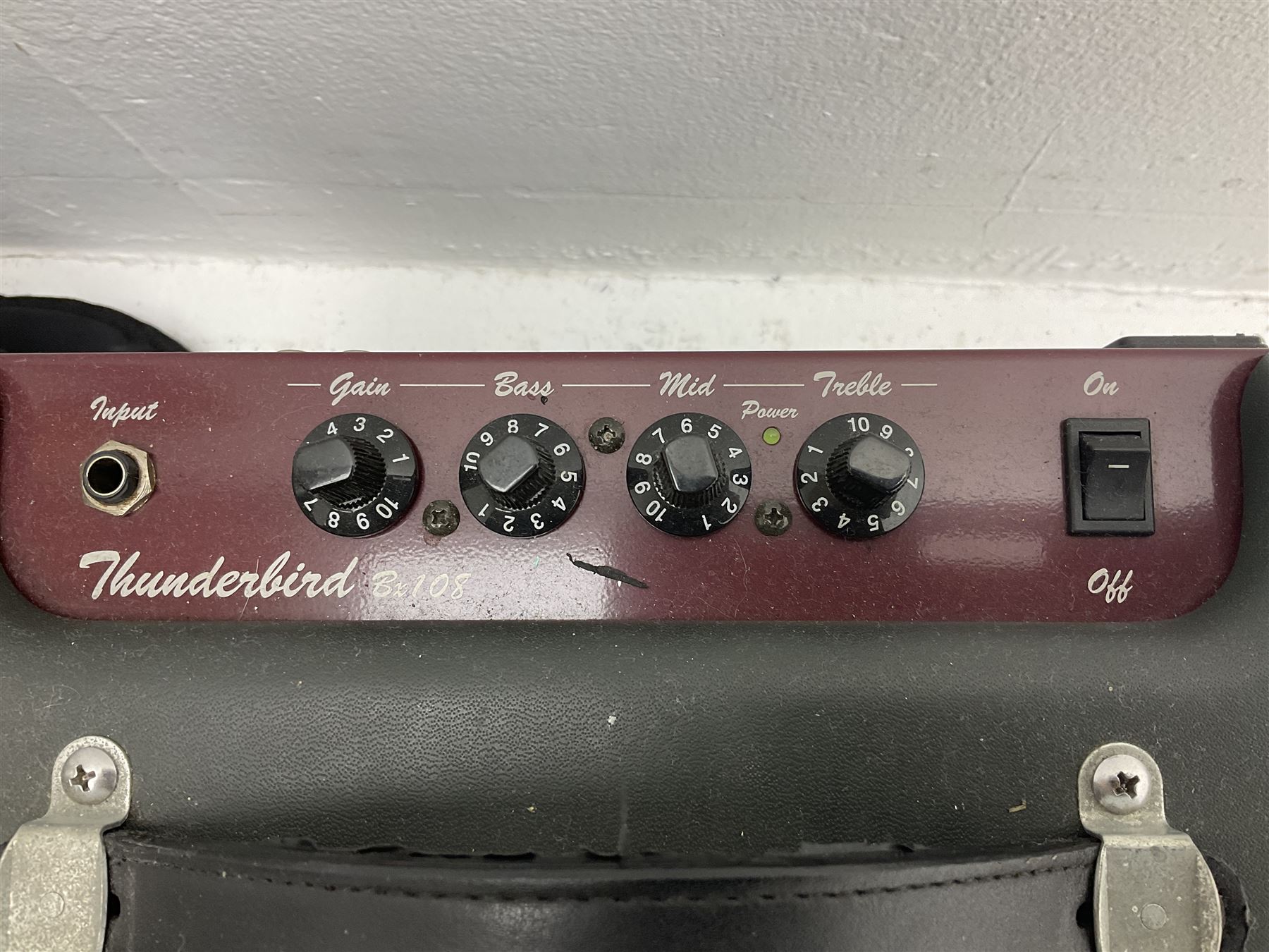 Richwood electric bass guitar in blue, cream and natural finish L117cm; in Fender soft carrying case; together with Behringer Thunderbird Bx108 amplifier date code 0 4 11.