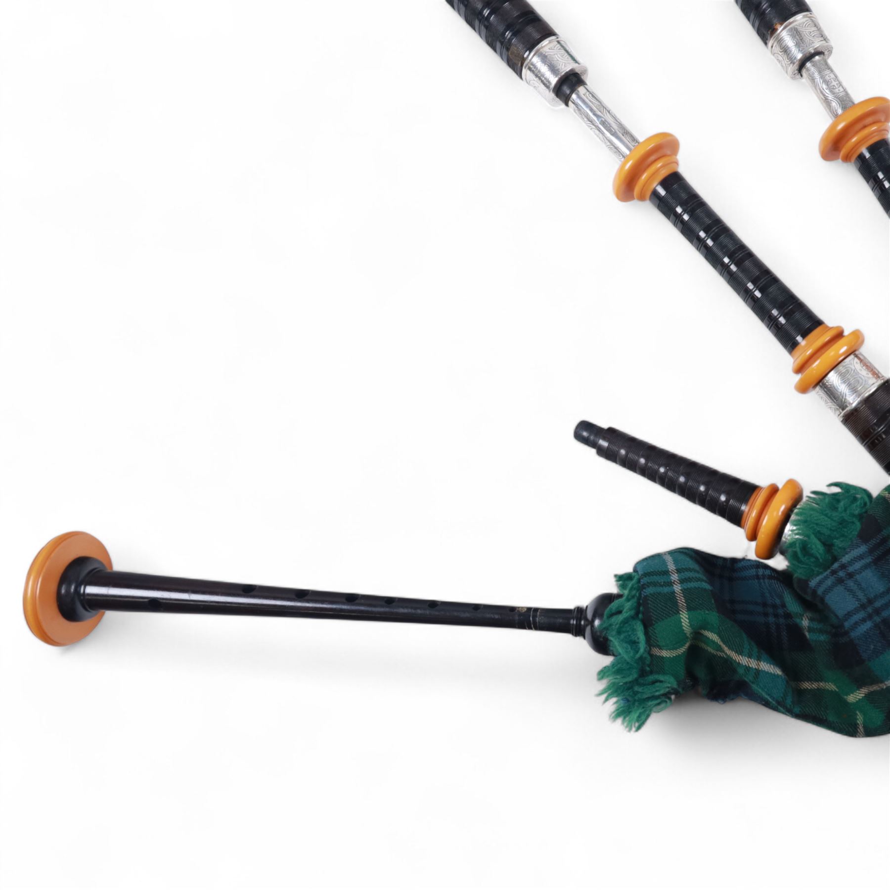 Set of late 20th century silver mounted bagpipes, the turned ebonised hardwood drone rods with Celtic knot and stipple engraved silver collars and ivorine mounts, hallmarked Bernie Leigh, Birmingham 1991, with R.G Hardie Glasgow plastic chanter and bag in green and blue Armstrong tartan, contained within a plush lined hard case, with a collection of spare reeds, drone rods, chanter, bags, cleaning accessories and other accessories 