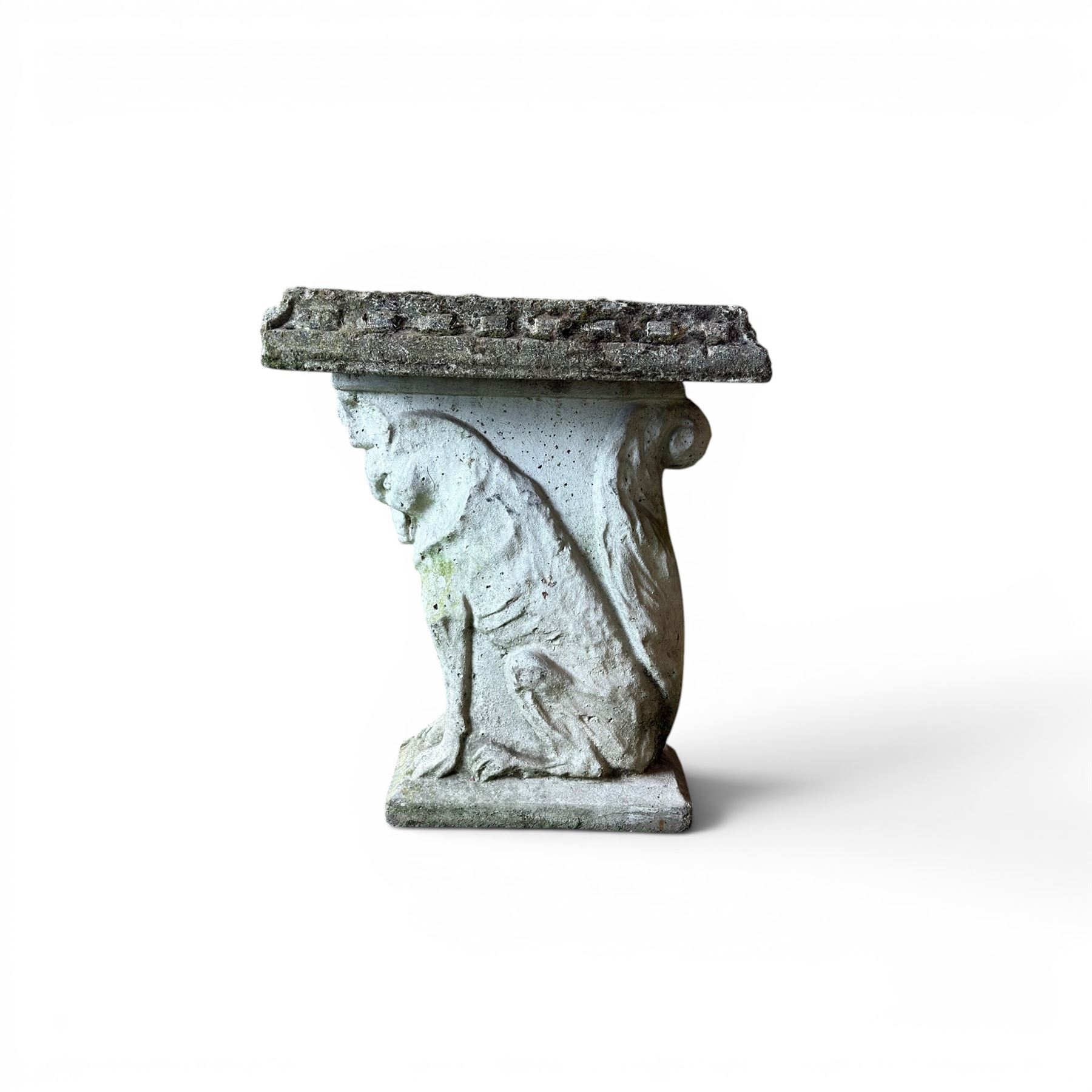 Weathered cast stone three piece garden bench, slab top raised on mythical creature supports