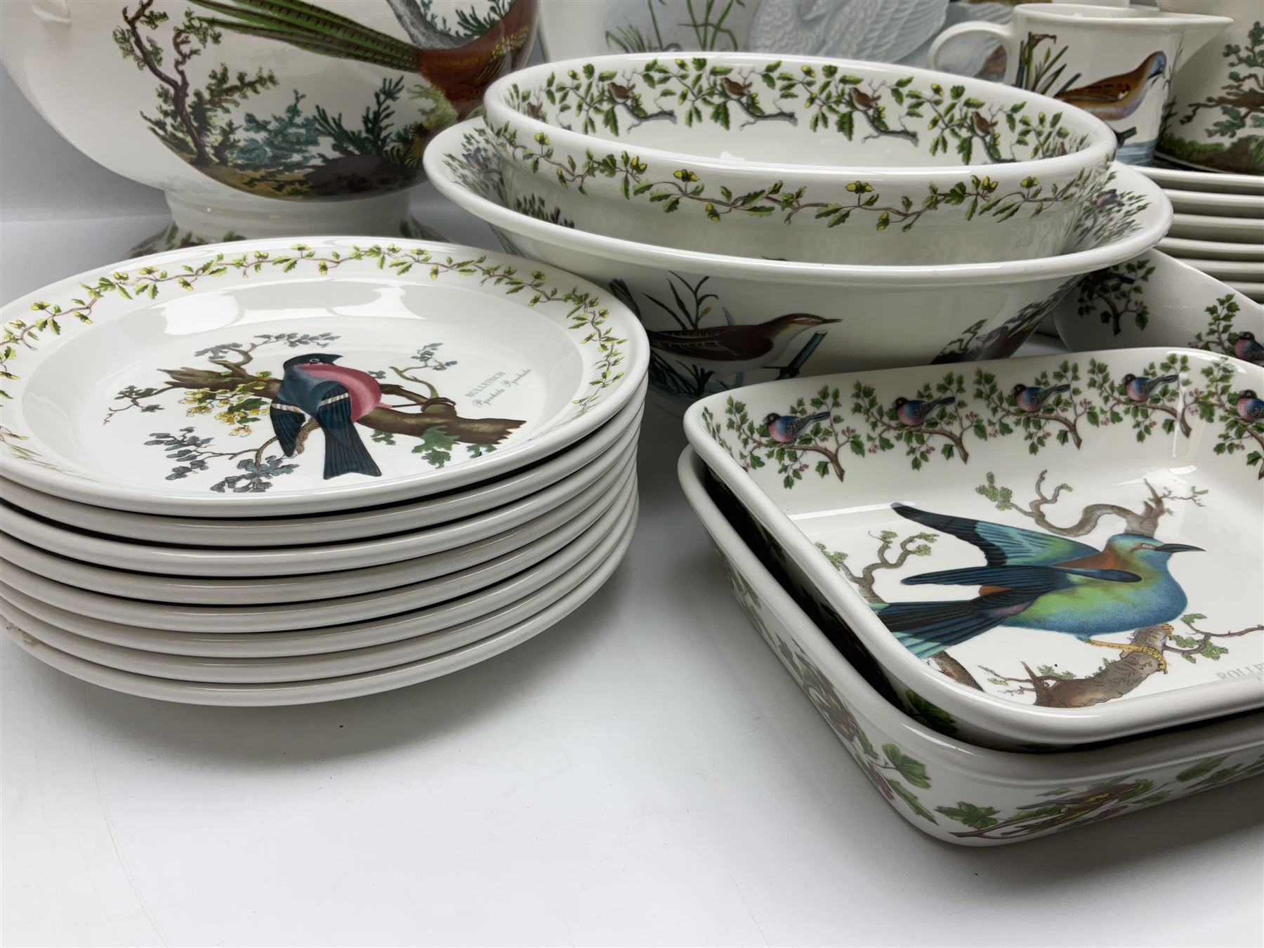 Portmeirion Birds of Britain pattern, dinner service for eight, to include covered soup tureen with ladle, dinner plates, soup bowls, side plates, oval plates, a serving platter, two oval serving dishes, salt and pepper, etc and eight shell dishes in the British fish pattern (56) 