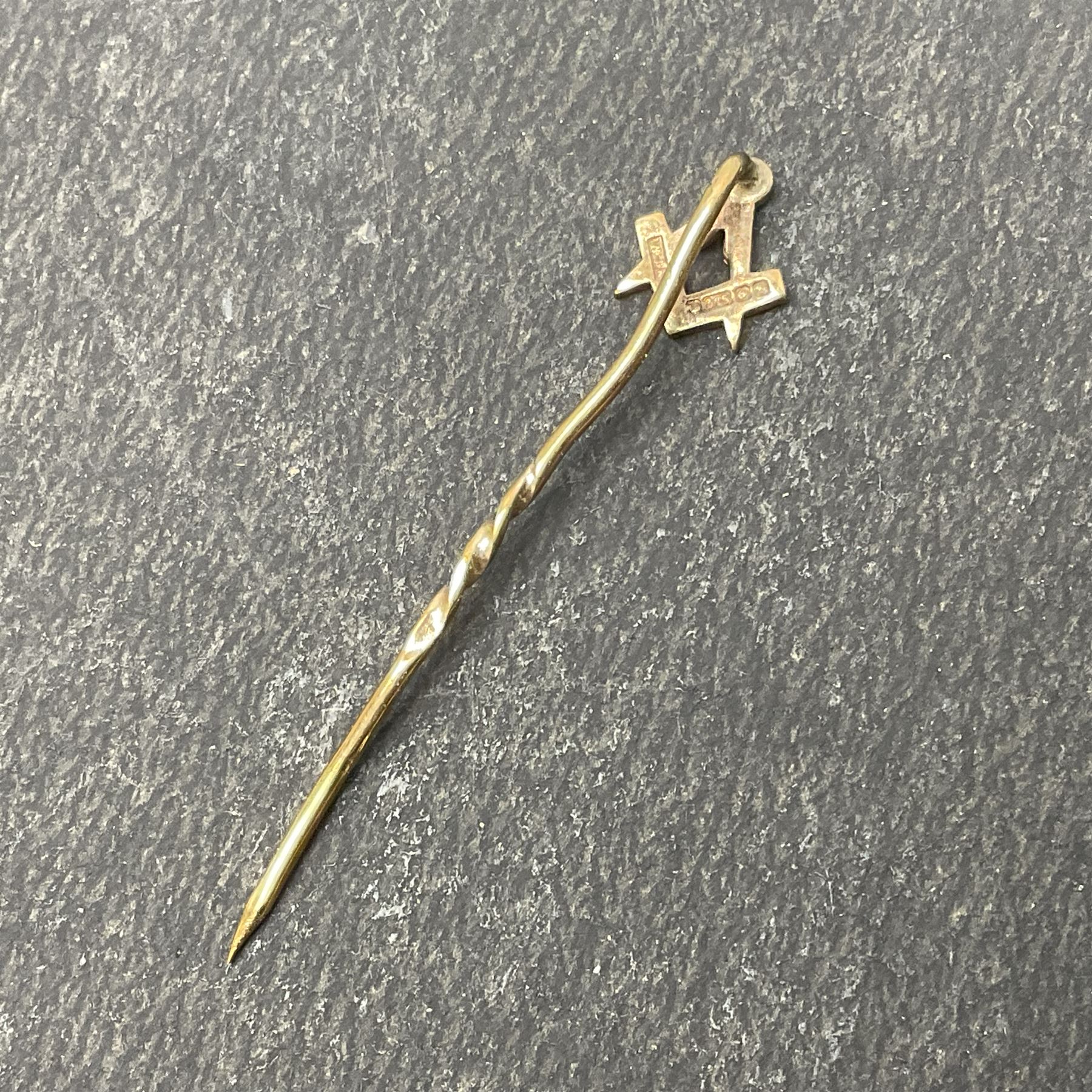9ct gold Masonic Past Masters jewel, presented to 'W Bro Keith Leonard Hoggard by the bretheren of the Lodge St Andrew as a mark of esteem for valuable services rendered as worshipful master 1989-1990', hallmarked, together with a 9ct gold Masonic stick pin and stud