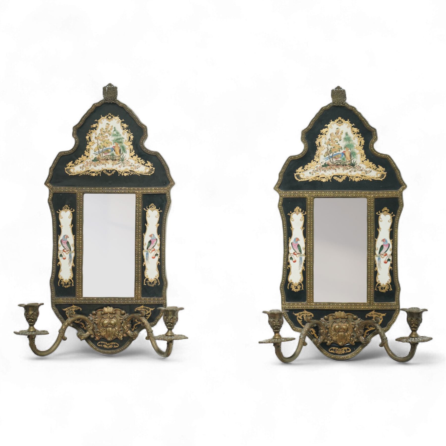 William Lowe - pair of early 20th century Rococo style girandole wall lights with bevelled plates within chinoiserie painted porcelain frames decorated with exotic birds, within bronze frames 