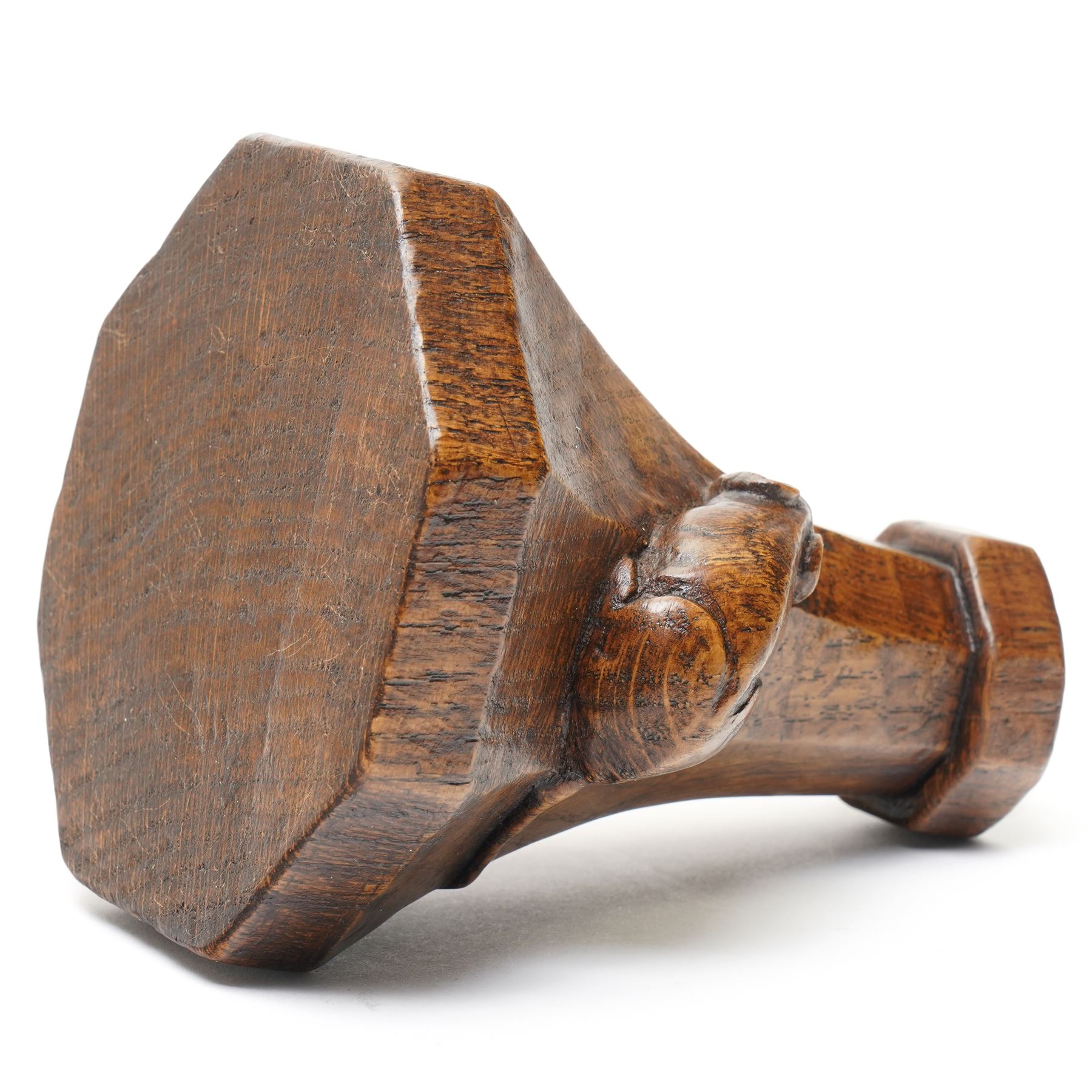Mouseman - 1920s octagonal oak candlestick of squat form with lappet top, carved with left-facing fat mouse signature with long tail, by Robert Thompson, Kilburn 