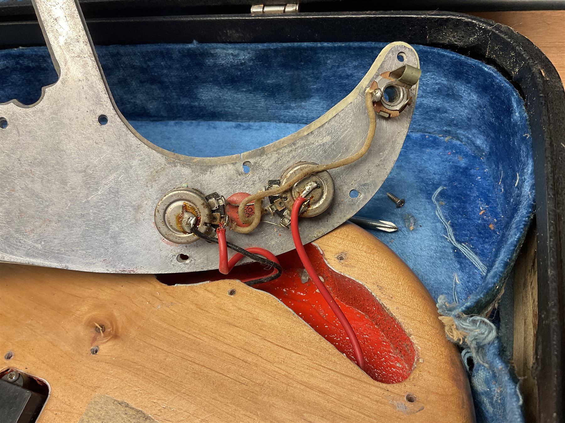 1962 Fender Precision bass guitar; re-finished in natural alder in the 1970s; impressed date code 5NOV62C to end of neck and serial no.90537 to back plate; L115.5cm; in replacement hard carrying case