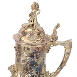 Large late 19th/early 20th century WMF Art Nouveau silver plated stein or jug, circa 1900, the bellied body cast and applied with Bacchanalian figures, the domed cover with putti finial, and handle modelled as a vine, the whole upon four fruit and leaf mounted feet, marked beneath for WMF and engraved with initials CHE and dated 1911, H40.5cm
