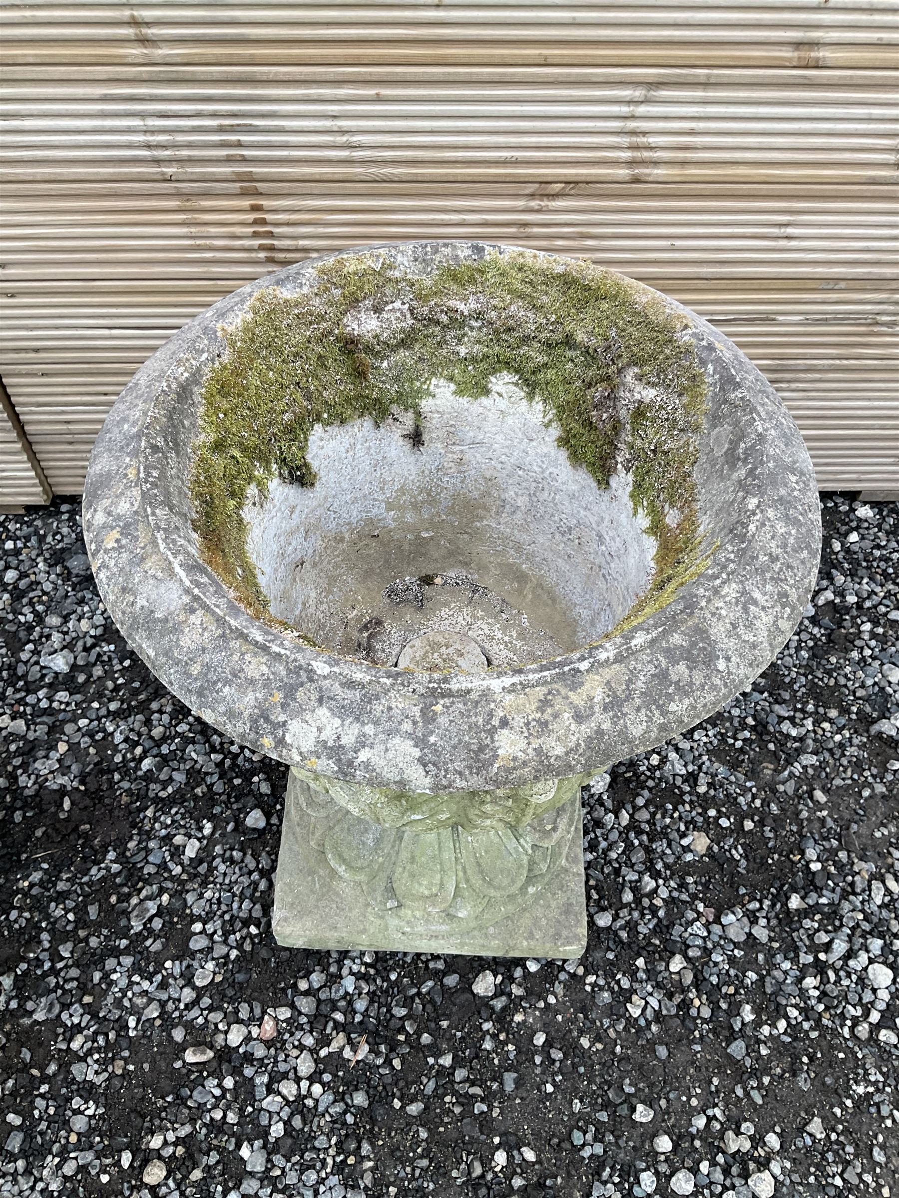 Cast stone urn, moulded rim leaf decorated body, moulded footed base on square plinth - THIS LOT IS TO BE COLLECTED BY APPOINTMENT FROM DUGGLEBY STORAGE, GREAT HILL, EASTFIELD, SCARBOROUGH, YO11 3TX