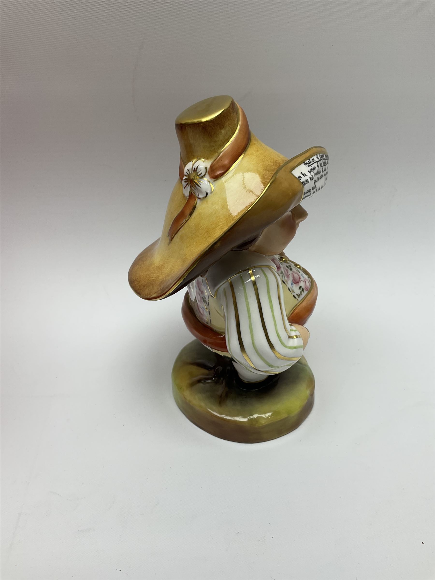 A Royal Crown Derby Mansion House dwarf, dressed in 17th century cavalier costume, with floral waistcoat and hate detailed Auction of Elegant Household Furniture and Effects, H18cm, with printed mark beneath and signed J.Aston, with makers box. 