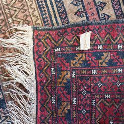 Persian Baluch style prayer rug,  hand-knotted wool rug, central mihrab design with geometric hooked motifs, corners with medallions, outlined in dark blue, with a stepped arch with hanging lamp motif at the top, main border on dark blue ground with alternating hooked and stepped motifs, guard borders with repeating diamond and chevron pattern 