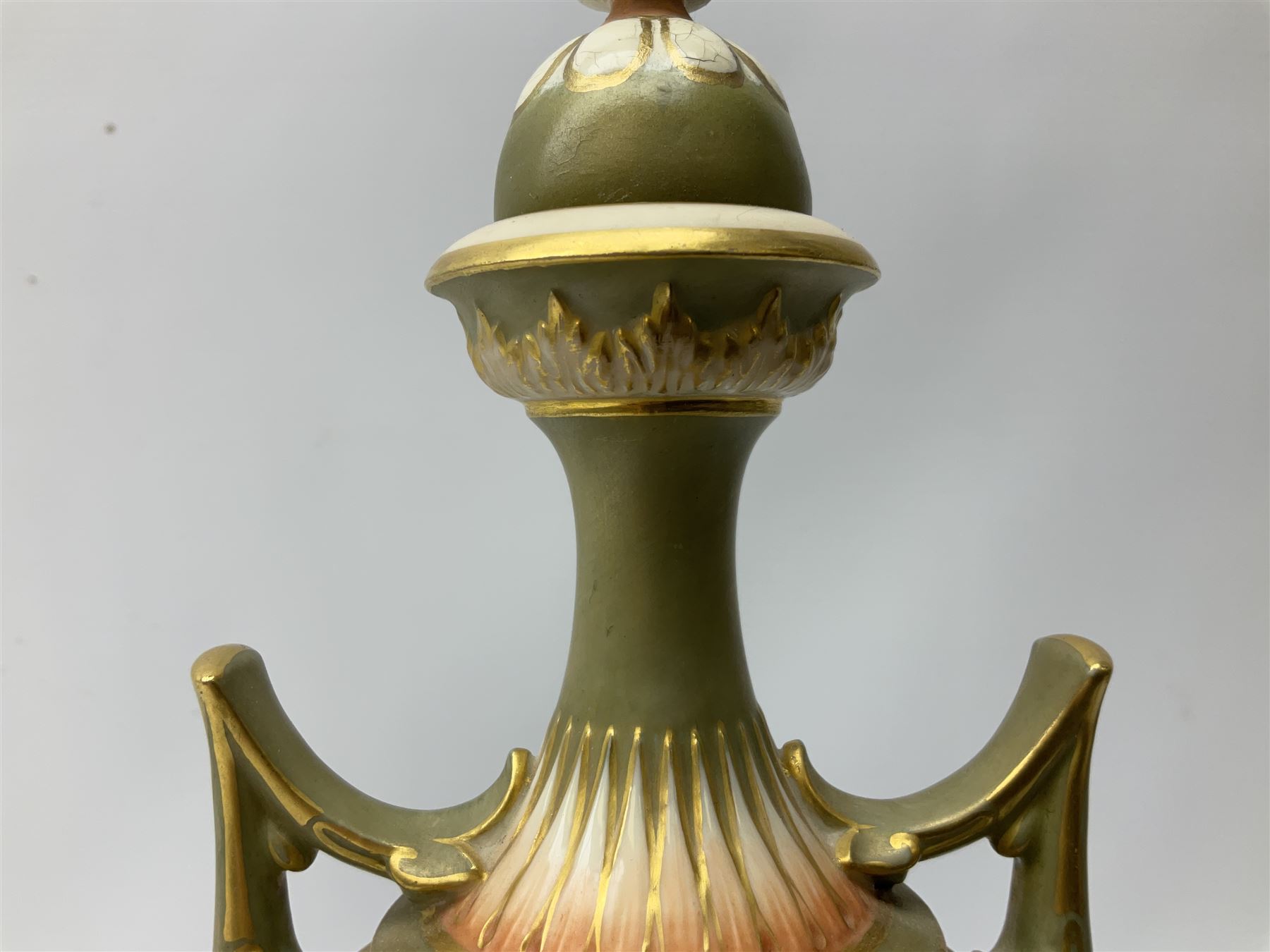 Early 20th century Royal Worcester vase decorated by Harry Davis, of ovoid form with twin acanthus mounted handles and waisted high neck supporting a domed cover, upon a circular foot, the body hand painted with sheep in a highland landscape, signed H Davis, with puce printed marks beneath including shape number 2425, and date code for 1907, H27.5cm