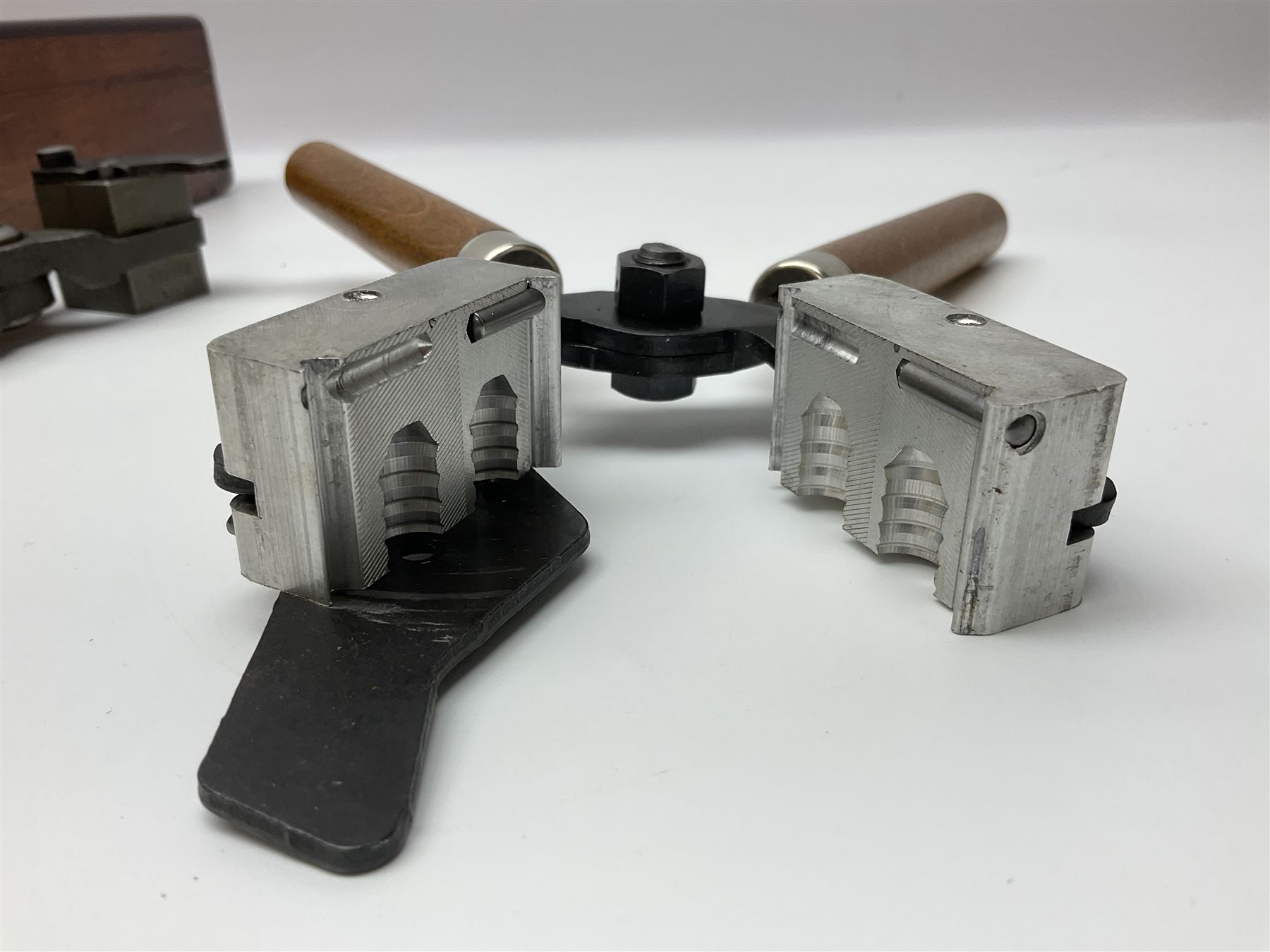 Three modern bullet moulds comprising Lee double cavity .44 calibre, boxed with instructions; and two Lyman .38 calibre; all in unrelated 19th century mahogany box