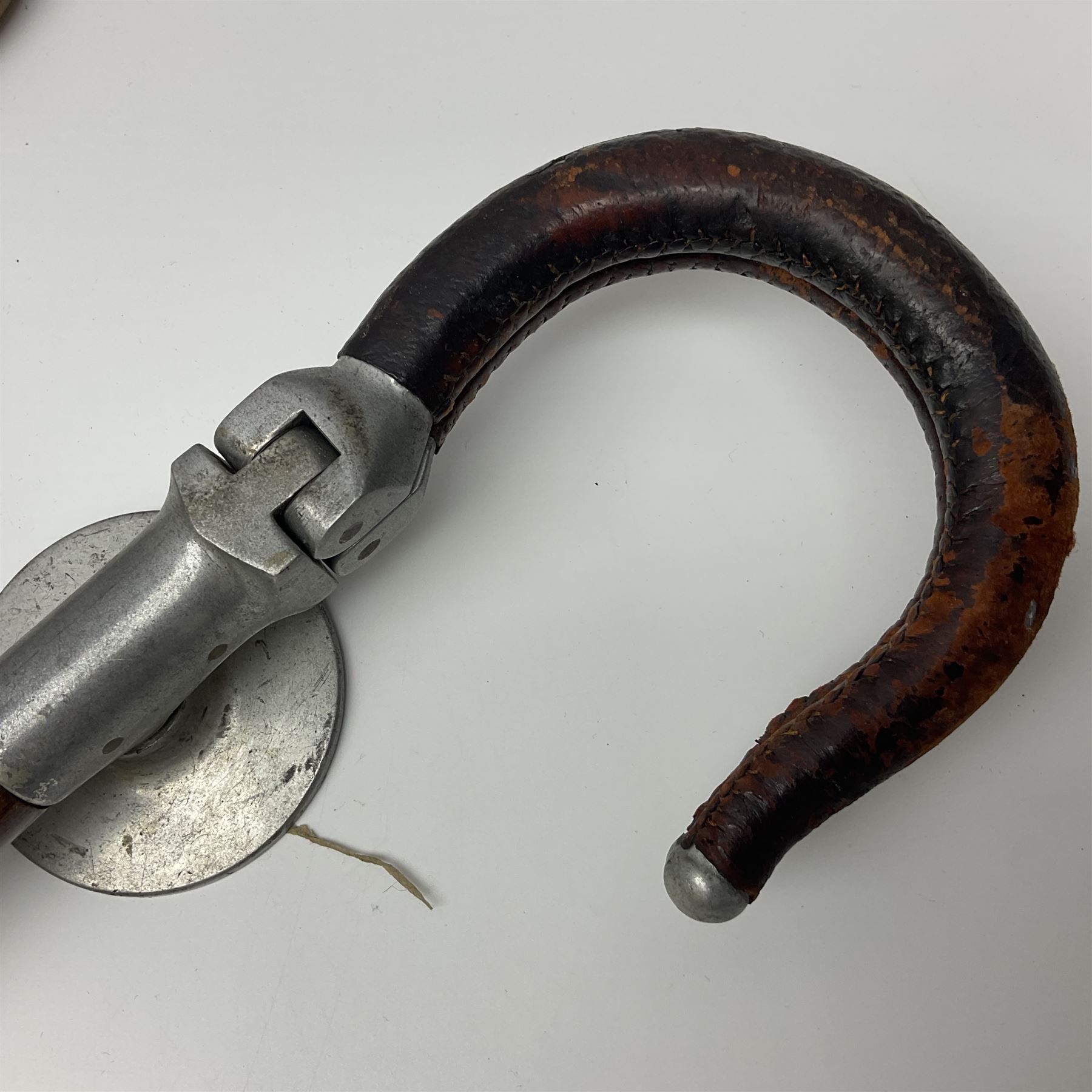Early 20th century curved horn handle walking stick with hallmarked silver mounts, engraved L Russell 1918, together with a shooting stick by William Mills Birmingham, with leather handle, 'The Featherwaite' shooting stick and an umbrella with wooden handle
