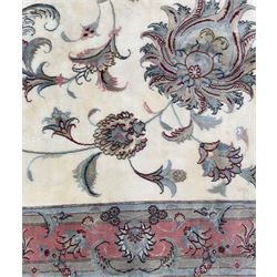 North East Persian Kashmar hand-knotted rug, ivory field with an all-over design of linked floral medallions and scrolling vines with a central circular medallion enclosed by multiple borders and a main broad madder field with palmettes and arabesques, 248cm x 145cm